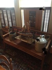 New bench, 5 gallon Red Wing jug, antique sled, primitive boat