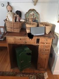 Pair of children store figures, plaster plaque of ship, antique baskets, Walnut Victorian watchmaker's bench with many drawers, green wall cupboard