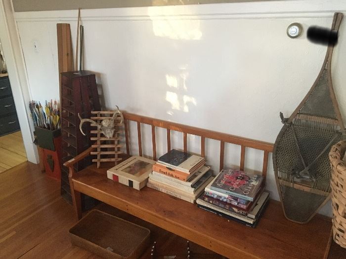 Arrow box with arrows, leather quiver with arrows, floor piece with lots of shelves, early pair of Native American made snow shoes, deer antlers on ladder type back, cherry bench