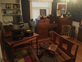 upstairs front bedroom- silhouettes, 1960s early American style desk, 1950s gentleman's dresser, wicker rocking chair, 1950s bed frame, hat boxes