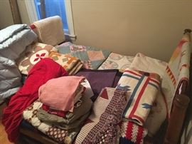 upstairs back bedroom- many antique and vintage quilts including several Amish ones