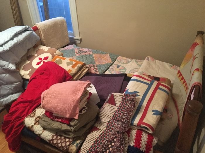 upstairs back bedroom- many antique and vintage quilts including several Amish ones