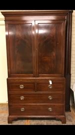 Fabulous Linen Press with plenty of room to house your clothing.  Solid mahogany with marquetry.
