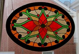 Signed antique oval stained glass panel