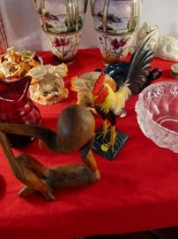 wood chicken pecking wood sculpture on the head 