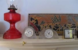 vtg oil lamp, Mikasa clocks working plus 1940's Asian carving in background 