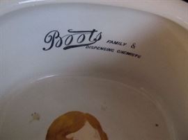 Mystery piece. Made by Boots Chemical Co. in the 19th. century. The mystery is what is Anne Bronte's painted portrait doing painted on a bed pan?  She was a famous author and this is a bed pan.