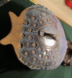 Pottery covered fish bowl