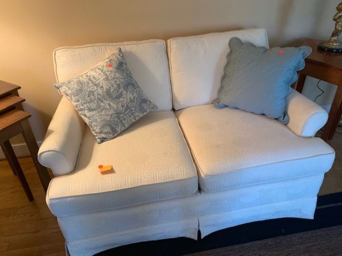 White fabric sofa, decorative pillows
