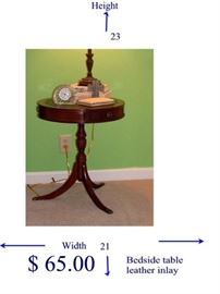 a bedside table with leather inlay