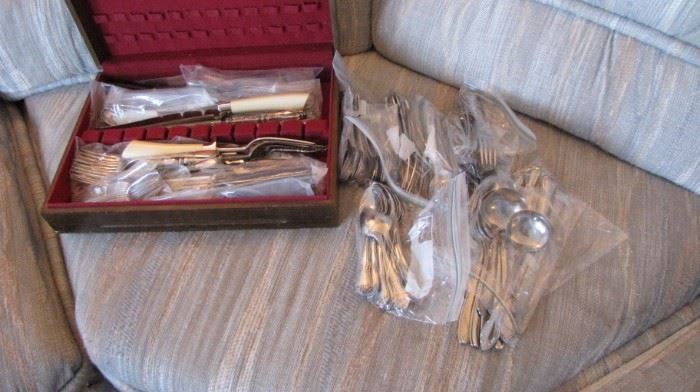 Two flatware sets, kitchen if over flowing !