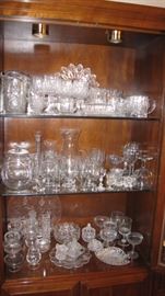 Cabinet full of crystal & cut glass.