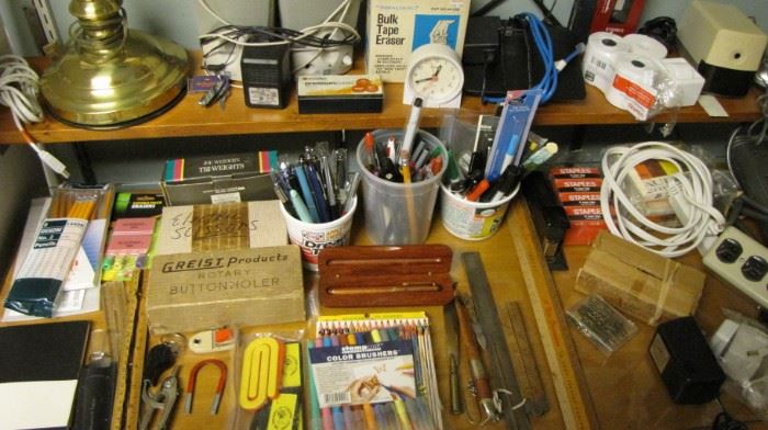 Desk full of office supplies