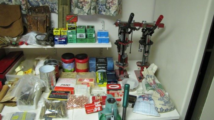 Table full of reloading supplies and tools. Mec loaders and press sets - Lyman - and more.