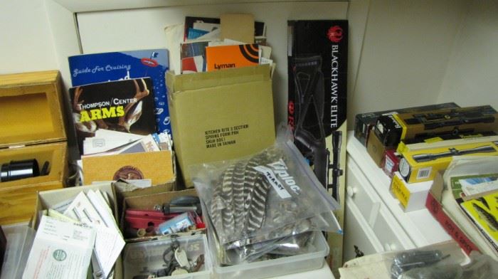 Feathers for fly tying, lots of paper and manuals.