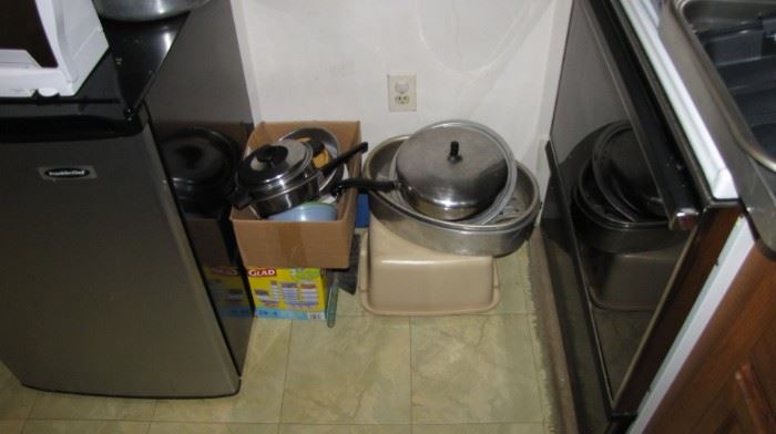 Second kitchen full of cookware - pot pans.