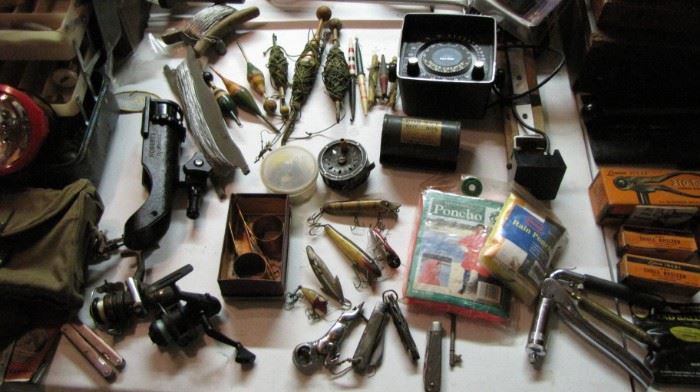 Collection of vintage fishing lures - wood bobbers - tackle and more.
