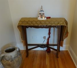 Dark wood side table. 2'8" wide x 10 1/2" deep x 2'6" tall. Good condition. Not heavy. Gold damask table runner also for sale. Village Hall light not for sale. The large jug is SOLD.