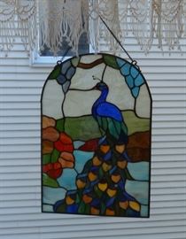 Stained glass peacock window decoration on a chain. Excellent condition.