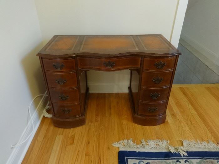 Antique desk, dark brown with leather inlay top. Pretty good shape. Size: 3'7" wide x 1'10" deep x 2'6" high.