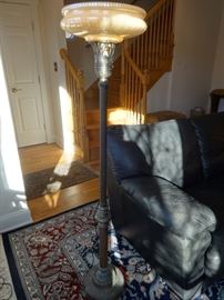 Antique brass & glass torchiere/floor lamp. Heavy. Glass is in good shape. Metal has patina of the years.