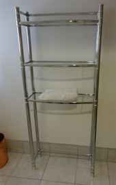 Metal and glass shelves bathroom towel rack. Size: 5'1" tall x 9" deep x 2'2" wide. Very good condition, could use a cleaning.