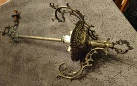 Antique Brass Light Fixture w/3 Candles. Size: 19" tall by 10" wide. Needs a glass shade.