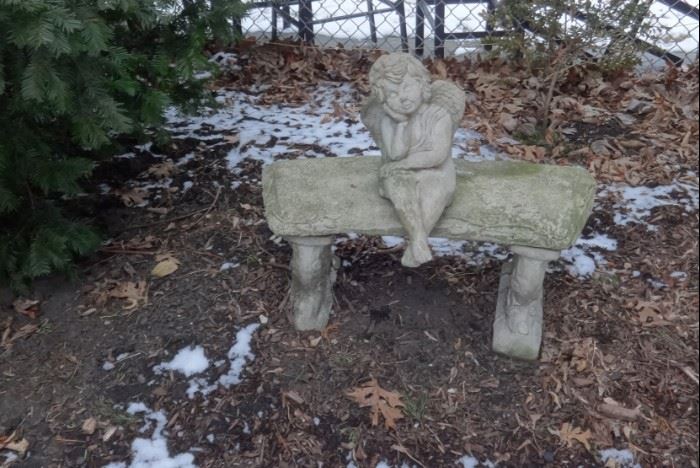 Stone bench & angel. Not attached to each other. Bench is in 3 pieces. Heavy