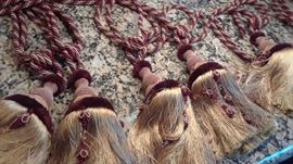 Four pair large old gold and burgundy drapery tiebacks. Also, large drapery rods and several sets of custom made drapes for tall windows in fawn and forrest colors.