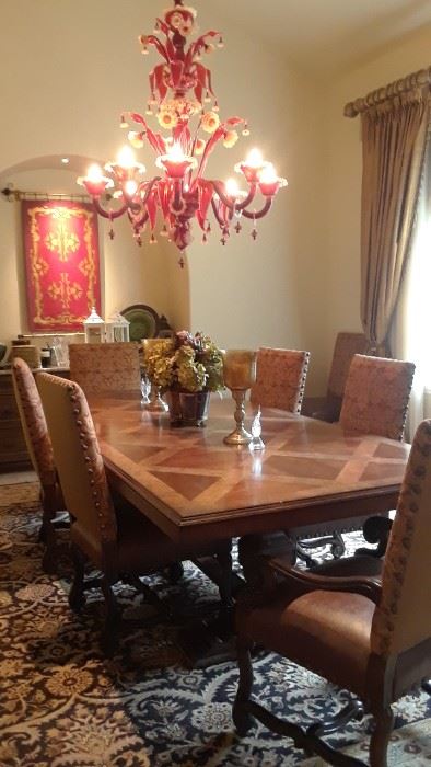 Tuscan style table. Ten chairs with telemetry print back rests