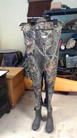 Lots of hunting gear including waders and camo pants.