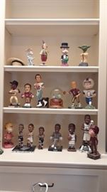 Bobble head collection of Spurs players and other sports figures, as well as cartoon figures.