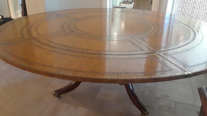 Large dining table, leather top. By Maitland Smith. Outer section is detachable.