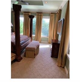 Drapes and rods shown are for sale. Glimpse of king bed frame for sale. Bench and chest are not available. Wall mount at right is one of several large TVs for sale.