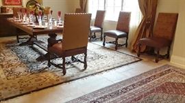 View of large rug in dining space and Persian rug in entry