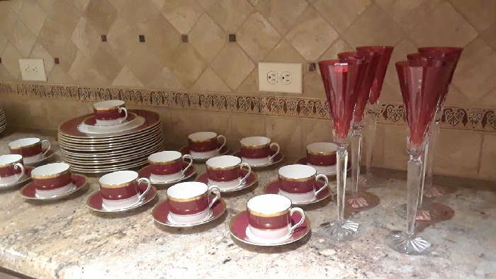 Coalport buffet service of dinner plate and cups and saucers, Waterford tall ruby champagne flutes.