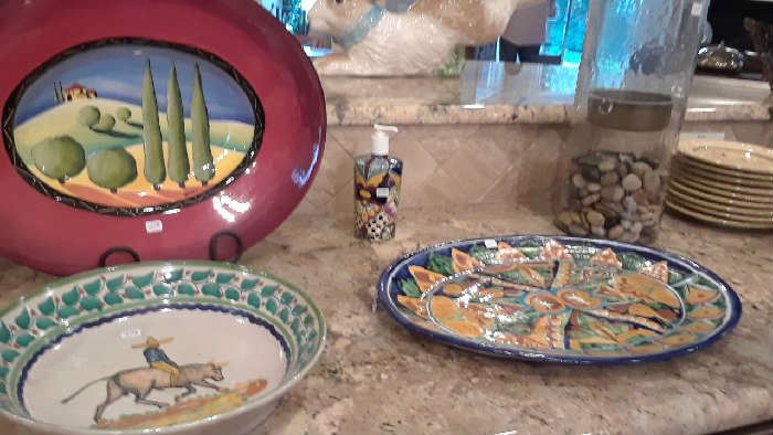 Bowl by Corky Gonzalez lower left. Talavera platter right. Not shown in photo is a fabulous large bowl with raised chili peppers.