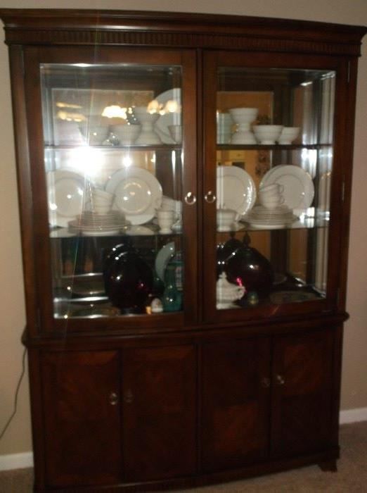 Nice large lighted china cabinet w/mirror back and glass chelves