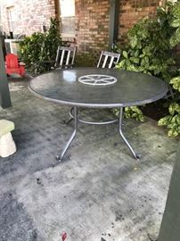#105 glass top round patio table $30.00
