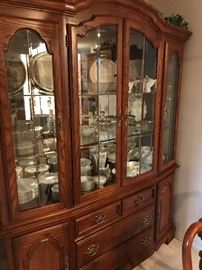 China and serving ware displayed in solid wood china cabinet!