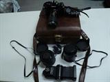 Canon A-1 Camera, Brown Case with Vivitar 285 Zoom Thyristor Flash, Sigma 21-35mm Ultra Wide Angle Zoom, Canon 50mm 1-1.8 Ratio Zoom, Tokina 35mm-105mm F3.5-4.3 Zoom Lens