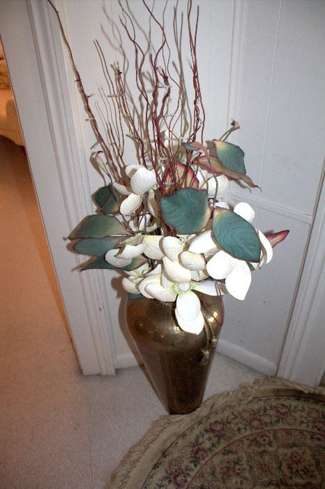Brass vase with floral arrangement