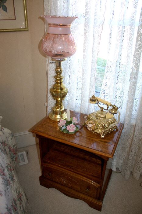 Nightstand, ornate telephone, lamp