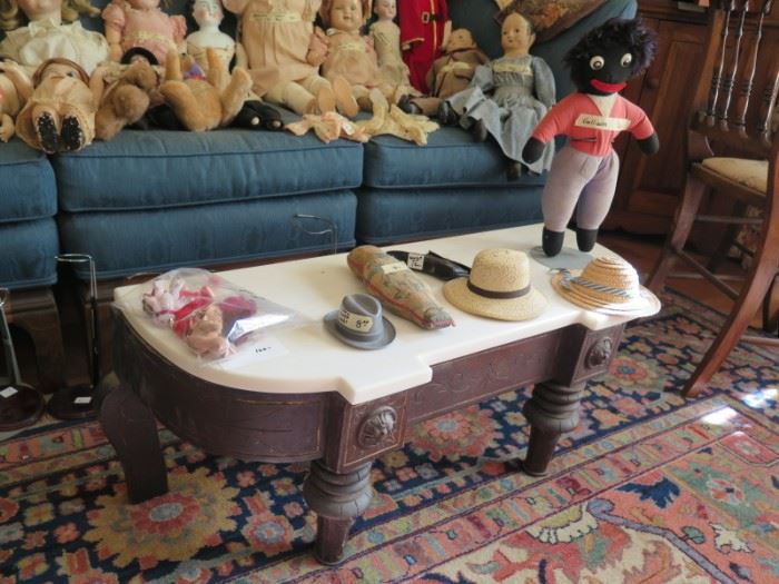 marble top pedestal and golliwog