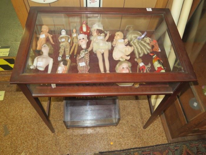 display case of dolls