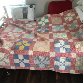 Hand quilted quilt, has small hole