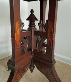 Victorian parlor table, solid wood and veneers, all hand crafted, with 4-legged pedestal base and original wheels.  28" wide, 20" deep, 30" tall.