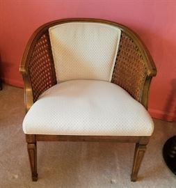 Pair of extra nice club chairs.  Solid wood with  caned sides, cushioned seats and backs; neutral cream colored fabric with tiny print.  No damage to caning, great condition.