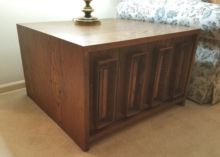 Large mid century end table.  Solid wood (dark oak) wity large storage behind double doors.  31" wide, 30" deep, 19.5" tall