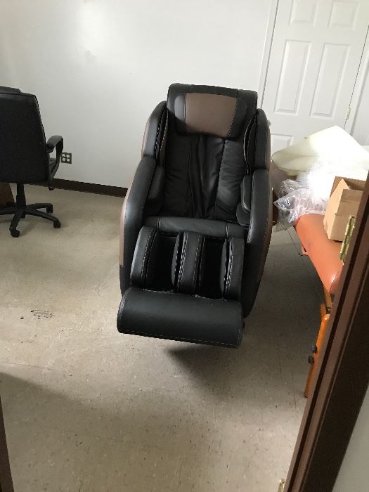 Brown leather chair with different massage strokes brand new for all body comfort with heat.  $1,800.00